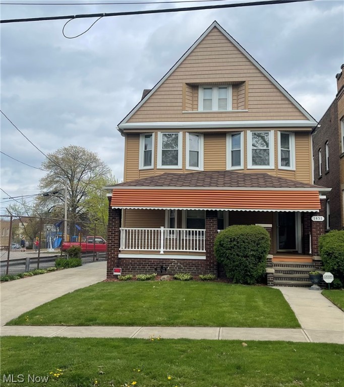 Welcome Home to 1451 West 116th St! This well-maintained 4 bedroom, 2 full bathroom home is situated on a sought-after street in the Detroit Shoreway neighborhood. The private porch is a perfect place to have your morning coffee, read a book, or entertain friends. Just past the front door boasts an open floor plan with refinished hardwood floors, a fireplace for those colder Cleveland nights, and large windows that invite natural light.   The renovated chef's kitchen has updated stainless steel appliances, offers granite counter tops, newer lighting fixtures, and plenty of storage!  On the second floor, you'll find 4 generous-sized bedrooms and a full large bathroom! In suite washer and dryer and full bathroom in basement. The large outdoor space with newly painted deck-located at the rear of the house- makes grilling, entertaining, and gardening FUN! You will love the convenience of this home being located just minutes from Edgewater Park, Lake Erie, Brothers Lounge, Lakewood,  shoppi