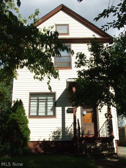 This wonderful 2-bedroom Colonial is perfect for a starter home or investment property.  Living room with built-in wall shelves and large front window for lots of natural light is open to formal dining room with built-in corner cabinet and breakfast bar.  Breakfast bar/counter is open to applianced kitchen space with lots of oak cabinets, abundance of counter space, and corner sink at window overlooking deck and partially fenced backyard.  Floor plan gives an open feel while maintaining the old world charm, complete with hardwood floors and banister.  Upstairs are two bedrooms, one with built-in cabinet/drawers, and full bathroom with ceramic floor and walls.  Full basement with washer and dryer and separate storage room.  Large deck in the back, in addition to large shed with electric, lights, loft and wood floor.  Backyard has recently been re-seeded.  Other updates include interior painting including basement, bedroom carpet approx 6 yrs, updated electric,  updated kitchen and bathr