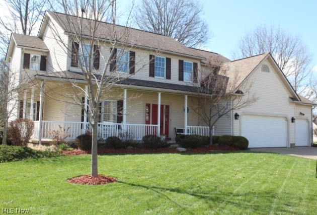 As you approach this beautiful home with a wrap around porch you will notice how well maintained everything is.  Entering the front door there is a two story foyer with wood floors. Throughout the home there are nine foot ceilings.   Entering from the garage there are custom built cabinets and cupboards for storage in the laundry room. The kitchen is a cooks dream.  Lots of cupboards and counter space and an island.  There is also room for a large table.   There is a fireplace in the cozy family room. The sunroom off the kitchen has two skylights and a nice view of the backyard with ponds, paver patio, deck and private back yard. The 4 bedrooms upstairs are spacious with walk in closets and the master bath has a glamour tub.  The basement is totally finished with an exercise room, a room with a built in bar, and a room large enough for a pool table.  The Bryant 3 stage high efficiency furnace was put in November 2012, hot water tank 2014, new lighting in foyer and kitchen, freshly pain