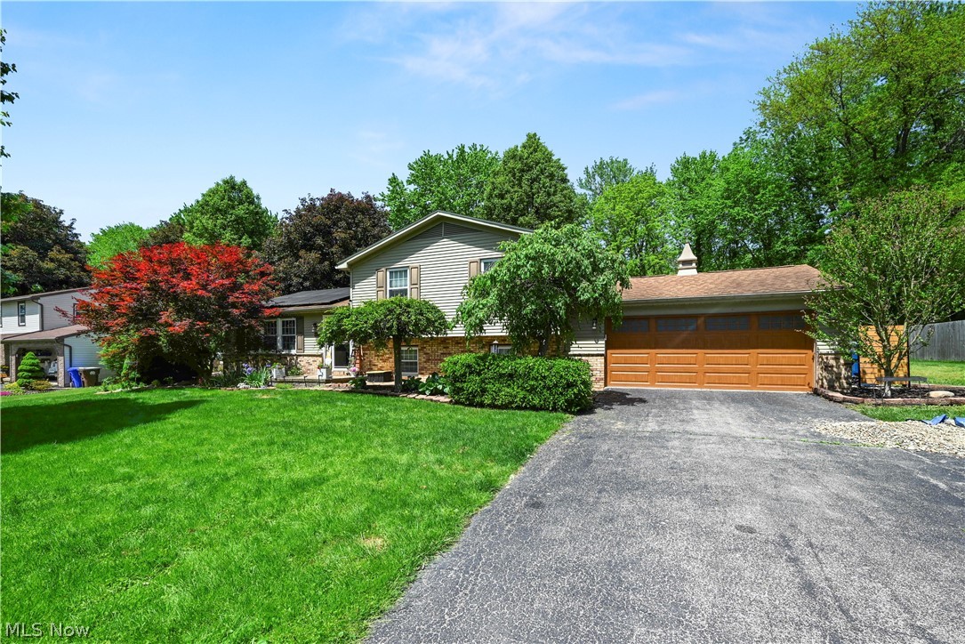 Beautiful 3-Bedroom Split-level Home located in a Well Sought-After Howland Neighborhood. This inviting 3-bedroom, 2.5-bath, 1,920 sq. ft. home sits on a generous 0.40-acre lot. Brick gas Fireplace enhances the ambiance in L shaped family room. Spacious Master-Bedroom with full bath. Kitchen offers plenty of cabinet space and includes all appliances. Built in 1974, the property blends classic charm with practical updates, offering comfortable living spaces and excellent curb appeal. Experience comfort, privacy, and suburban living in this well-maintained home Nestled on a quiet street surrounded by mature trees and well-kept homes. Offering the perfect blend of peaceful living and convenient access to shopping, fine dining, parks and major routes. Added Bonus of a complete solar panel system, making this a wise decision for efficiency! Perfect time to enjoy lounging by the above ground pool, 2 tier decks, enclosed sunroom and delightful back yard!  Seller has added a 1-year Home Warranty for added peace of mind. Call Today to schedule your personal showing!