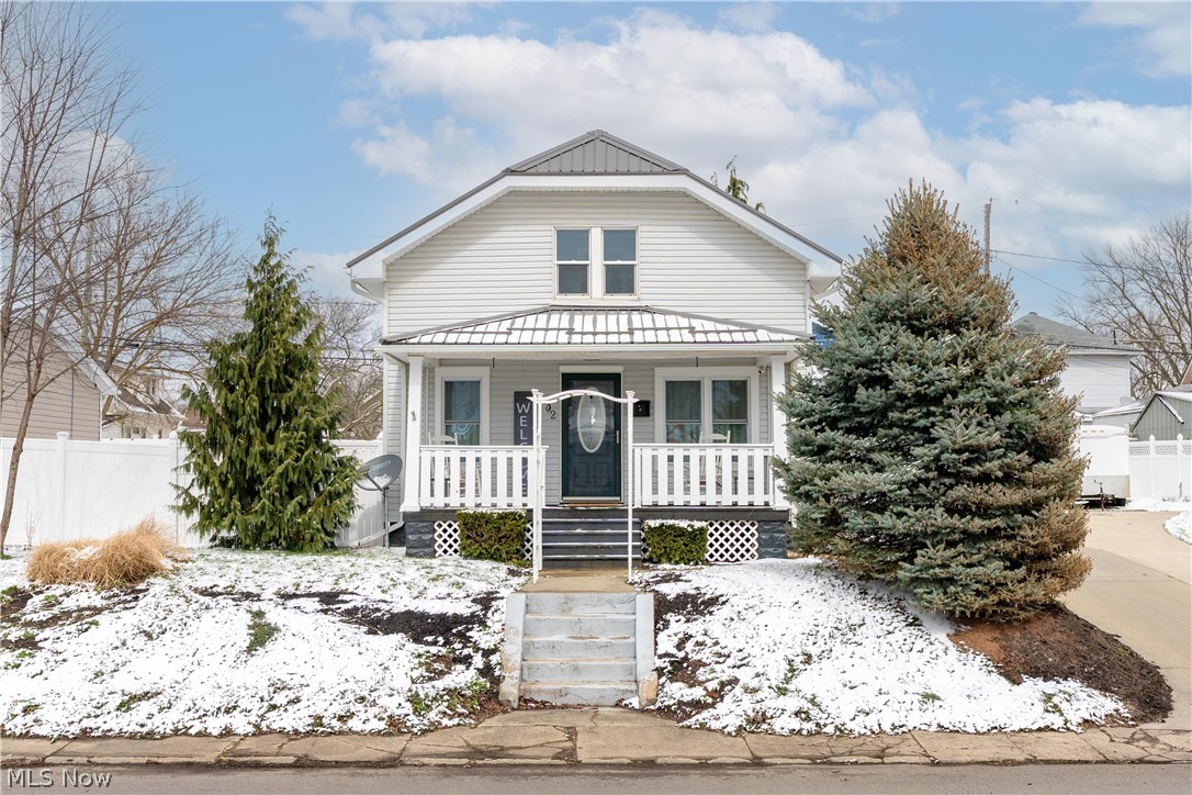 Welcome to this charming bungalow-style home in Massillon. Step onto the covered front porch and enter the inviting living room and kitchen, providing a warm and open flow ideal for everyday living. The first floor also features a full bathroom for convenience. Upstairs, you’ll find two cozy bedrooms, including one with a built-in safe for added security. The partially finished lower level provides additional living space, perfect for a family room, hobby area, or home office. Outside, enjoy a private patio for relaxing or entertaining and a partially fenced yard. Car enthusiasts, hobbyists, or those who love to host will be impressed by the expansive 24x32 garage and attached 22x14 workshop. The garage is equipped with a propane heater, a mini-split system for heating and cooling, and a TV with a sound bar all of which will stay with the home. This home combines everyday convenience with thoughtful extras, making it an ideal spot for both relaxation and hobbies. Don’t miss your chance to see it!