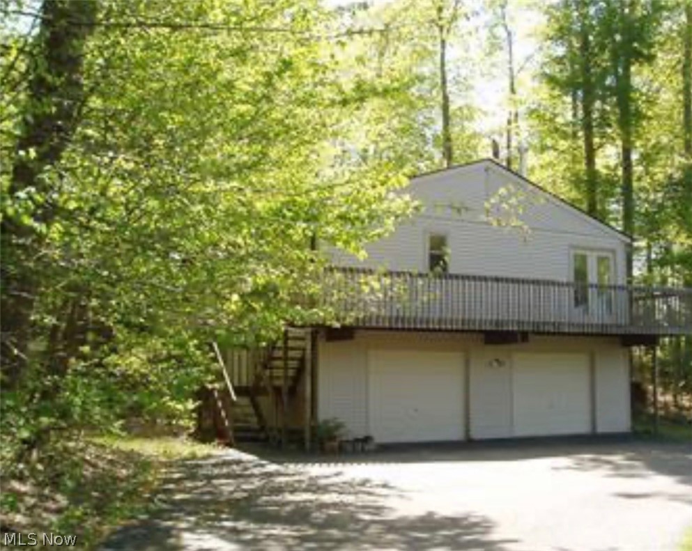 Escape to your own secluded retreat in Newbury Township. A charming cottage-style house or potential rental opportunity. Rare opportunity for privacy and country living. Enjoy the beauty of nature while still being conveniently located near local amenities. Audio & video surveillance. Camera's on all points of property. DO NOT WALK/ENTER PROPERTY WITHOUT AN AGENT. Guard dogs on duty. May bite