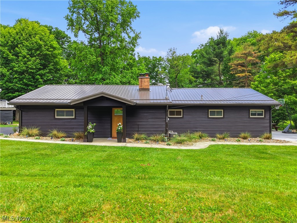 This incredible LakeFront home offers stunning views , dock and direct lake access. A covered front entry welcomes you in to explore this completely updated home boasting 3 bedrooms,2 bathrooms and multiple living spaces. Enter into a family room with brick fireplace and large dining space with recessed lighting and water views. Step into the private owner's room with a double closet, tucked away from the hustle and bustle of the main house. Make your way into the updated kitchen with center island, pantry cabinet storage and all new fixtures. ALL appliances stay! The kitchen overlooks the second living room with access to the 3 season room, full bath and 2 additional guest rooms. The main bathroom has been lovingly updated with all new fixtures and flooring! The 3 season room is the ideal flex space perfect for entertaining or unwinding as you watch the sunrise or set. A laundry room and half bath complete this interior. Exterior features include new landscaping, two driveways and an attached garage! Notable improvements in 2025 include Ionizer, RO System, New flooring and paint throughout. New lighting and plumbing fixtures. Updated bathroom. New metal roof, gutters, downspouts, facia, soffit and flashing. New front door entry and overhang with all new landscaping, concrete walkway and addition of second driveway. All the windows have been replaced! Located in the Atwood Valley community at Atwood Lake and is situated on private land that is not leased!!