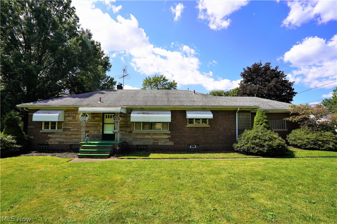 You don't want to miss this never before listed brick ranch on two acres in Tallmadge! This home features a three bedrooms and three full baths! The living room has a fireplace to enjoy the cool autumn nights that are right around the corner. The bedrooms are generously sized! Outside you will enjoy a closed in porch overlooking the back yard. There is a two car attached garage as well as an outbuilding that will easily house 4-5 cars! 
There is so much to love in this beautiful home, you will want to schedule your showing today!