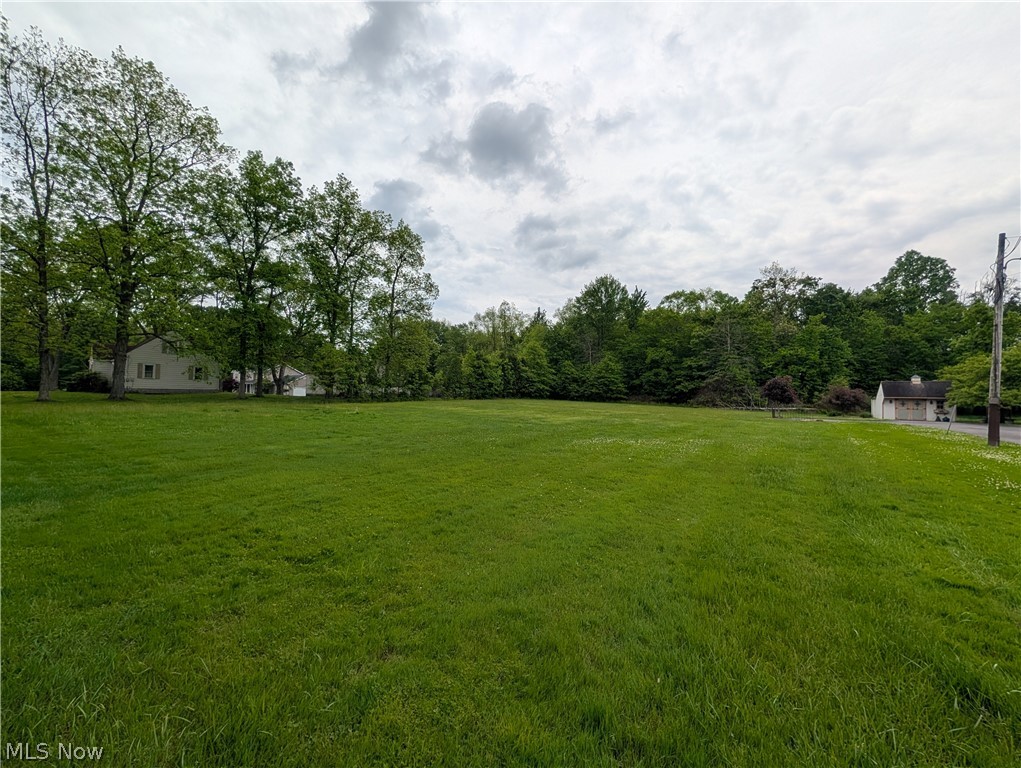 Located in Green Township within the South Range School District, this 2.21-acre property offers a combination of wooded and open ground in a convenient Mahoning County location. Situated adjacent to 9361 W Western Reserve Rd in Canfield, Ohio, the parcel features approximately 150 feet of road frontage and extends roughly 633 feet deep, providing a functional layout for a variety of potential uses subject to local zoning and township regulations.

Approximately 1.6+/- acres of the property are wooded, offering privacy, natural screening, and a scenic backdrop. The remaining acreage is open ground with generally flat topography, creating flexibility for future plans such as a residential homesite, recreational use, or additional outdoor space. The mix of wooded and open terrain provides both usability and natural character while remaining manageable in size.

The property’s flat terrain makes for easy site planning while its location along W Western Reserve Road provides convenient access to nearby communities, services, and major routes throughout Mahoning County and the surrounding area. The parcel is located within the South Range Local School District and is positioned near Canfield, Greenford, and Boardman. Call today to learn more about this fantastic lot today...it won't last long!