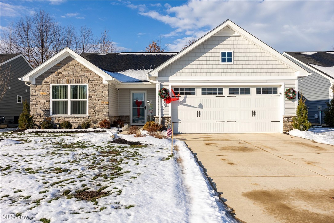 Why build? You'll love this move in ready and SPOTLESS ONE LEVEL RANCH nestled in the popular Landings at Ridgewater community! No need to deal with blind installs, lawn/landscape or a patio, it's all done and tastefully appointed! Pull up to an attractive, well-kept exterior complete with stone and craftsman accents!  NO CARPET, upgraded LVP wood look flooring throughout (including both bathrooms) !  Great room concept opens to the kitchen complete with an island, pantry and stainless steel appliances that stay! Open concept is light and airy! Owner's bedroom is away from the other two bedrooms and offers a walk-in closet and a private full bath with dual sinks and shower stall. 2 car garage with storage nook. Concrete patio and brand new gutter guards. Backyard has a touch of nature with a treeline buffering the view from rear neighbors! Maintenance fee takes care of the lawn mowing and snow removal! Move in and enjoy, look here before building!