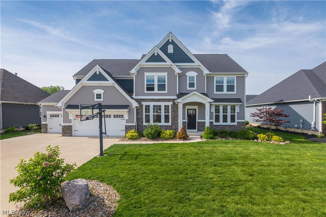 WOW! Be the first or be sorry. Welcome home to this stunning custom 2020 built Ash Lawn Model Home! Located in one of the area's most exclusive development - North Ridge Pointe Community! This beautiful custom home has 5 bedrooms, 4 full baths, a Partially finished basement and upgrades galore! Soaring 2 story Great Room features a wall of windows, and an upgraded stone feature gas fireplace, surround sound and a mounted TV. The eat-in kitchen is a chef's dream with upgraded stainless appliances, huge island with quartz counters, tile backsplash, plenty of cabinetry and a pantry. One bedroom is located on the first floor, and 4 bedrooms (including the master suite) are on the second floor. Convenient 2nd floor laundry room. Relax in the backyard on the 930 sqft stamped concrete patio with Professional upgraded landscaping. The driveway has been widened to accommodate 9 cars. NOTHING left to do but move in! This is a Must See!!