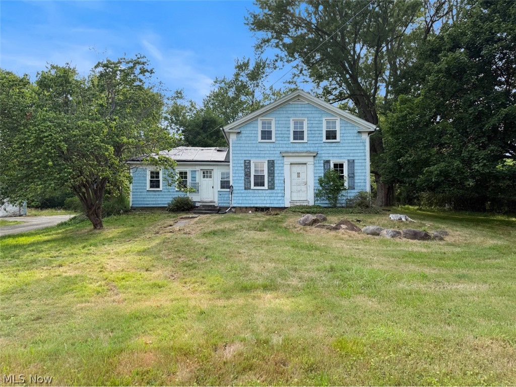 Excellent rehab opportunity in the Chagrin Falls School District! This historic farmhouse sits on nearly 1.5 acres. Much of the original character remains intact, including window trim and crown molding, while newer vinyl windows have been installed throughout. The property also includes several outbuildings, including a 3-car garage, a large heated workshop, and a barn. The home is in need of a full rehab, offering a great opportunity to restore and reimagine a unique property.
