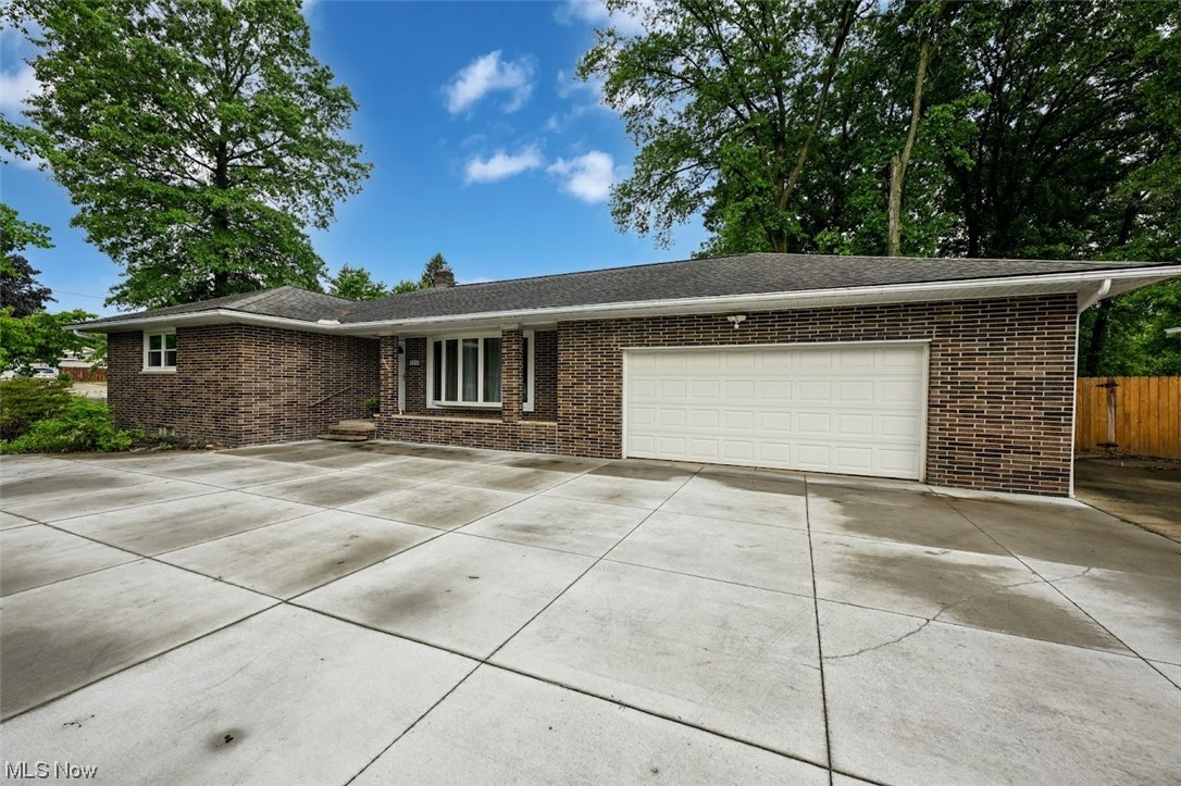 Welcome home to this brick ranch home with 3 spacious bedrooms, 2 full bathrooms,2 Full Laundry rooms basement and first floor, updated kitchen, wood flooring and partially finished basement! The outdoor space here is amazing! Enjoy a heated pool with deck, fully fenced yard, huge patio and shed! This yard is perfect for your summertime entertaining or relaxing! The 2 car attached garage plus a 26x26 detached shop building with electric and water, is just waiting for those hobbies and car collectors!  Plenty of parking too with a horse shoe concrete driveway! Newer Roof, Windows, Well pump, Newer Septic System, Newer garage door opener, New Whole House water softner system, All New Stainless Steel Appliances. There is so much to offer here and conveniently located too! Near shopping, dining, schools and parks! Just move in and enjoy! Don't wait....schedule those showings today!