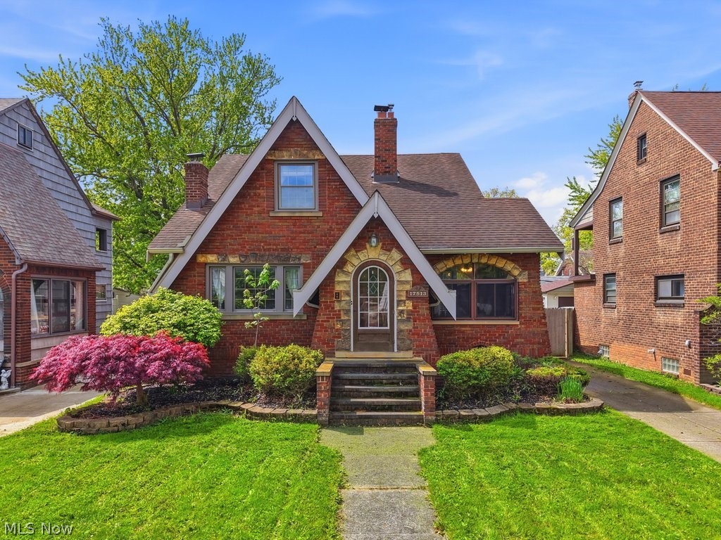 There’s just something about a West Park Tudor…the brick, the stone, the arched entry that sets a slightly whimsical but sturdy tone before you even step inside. And once you’re in, it delivers. Original woodwork that hasn’t lost an ounce of character. Original wood doors that feel like they’ve held nearly a century of stories. Crown molding, hardwood floors, and a stunning sandstone fireplace that really does need to be seen in person to appreciate. The kitchen is classic and functional with Corian countertops, generous cabinet space, and a charming eat-in nook that’s perfect for quick breakfasts, casual dinners, and anyone who insists on keeping you company while you cook. Off the living room, a three-season porch that will quickly become your default location for morning coffee, mid-afternoon catch-up calls, or a drink with friends in the evening. Two bedrooms and a full bath round out the 1st floor, with one room offering a little flexibility depending on how you live. It connects through to the deck, which makes it especially well-suited as a den, library, or tucked-away office. Upstairs, 2 additional bedrooms and a layout with options! One of the bedrooms includes an attached bonus room that works beautifully as a sitting room, dressing space, or even a huge walk-in closet, along with a convenient half bath that adds just the right amount of function (and a little retro charm). Downstairs, a full basement with all the storage you need. Outside, a fully fenced yard with driveway gate and generously sized deck with arbor and grape vines is perfect for summer nights. You'll be happy to have a 2 car garage with new roof '17 and masonry work '21 as well! This home is solid. And charming. It’s move-in ready with an opportunity to make it your own over time, something that buyers are always hoping to find. Major mechanical updates include replacement windows throughout the home, HVAC in '22, HWT '17, and appliances updated in '18. Come see the charm for yourself.