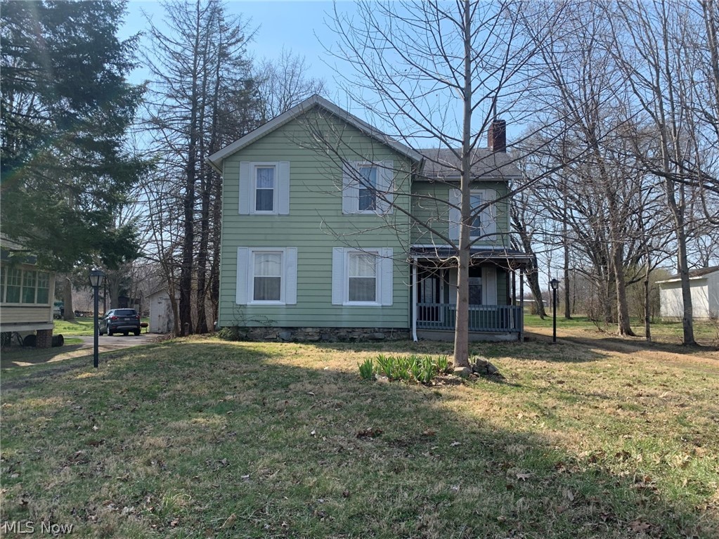 Have you been looking for a large house with over-sized rooms?  This home has been converted to a single-family home from a multi-family.  Beautiful new hickory kitchen, newer flooring, carpet and paint.  Home includes stove, refrigerator, washer and dryer.  Quaint fireplace for those cozy night.  Full bath on 1st and 2nd floor.  First floor master and laundry room.  Outdoor shed looks log cabin-ish.  There is also a small garage.  The rear yard is large and private.