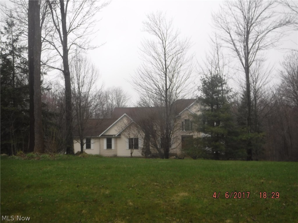 Fabulous, spacious four bedroom newer home with a 3-tier Deck and lower level patio which can be reached from the walk-out basement. This home has a First Floor master suite and a two story great room!  Barn with stable and fences, and an in-ground pool sit on this beautiful acreage.  It just needs your love and affection to be restored! Being sold in as-is condition.  No repairs by seller. All financing accepted.