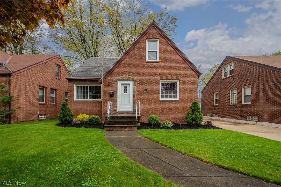 Move in ready brick bungalow in West Park! This cozy 3 bedroom, 1 full 1 half bath home has so much to offer at such a great price. Foyer leads into cute living room with decorative fireplace and hardwood floors. Kitchen opens to the living area and features an eat-in counter space that fits up to six people.  Updated full bath on main floor feels fresh and clean. Two first floor bedrooms feature hardwood floors and neutral colors. Upstairs has been freshly painted. Room at the top of the stairs is currently being used as a walk in closet but has potential to be converted into an office space or reading nook. Dormer bedroom could be used as a master or private guest room. In the basement you'll find a finished rec room that offers extra living space as well as convenient half bath. Unfinished portion of the basement provides plenty of storage space. High efficiency furnace was installed in 2013. Newer one and a half car garage and repaved driveway with large pad for extra parking space