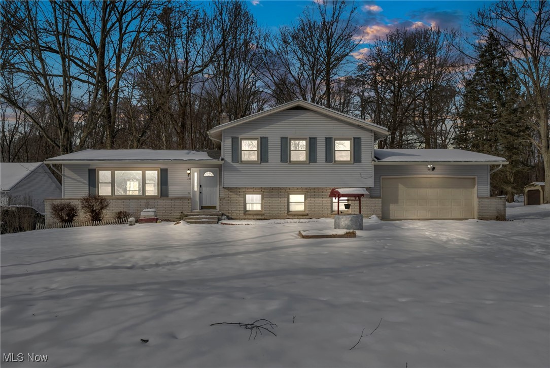 This home offers plenty of space and comfort, perfect for both relaxation and entertaining. The split-level design gives a nice flow between the different areas of the house, with large rooms throughout. The kitchen is a standout, featuring updated stainless steel appliances and a generous amount of cabinet space for all your storage needs. Bedrooms are spacious, providing a comfortable retreat. The lower-level living room is cozy, complete with a fireplace, and it opens up with sliding glass doors to a 3-season room that could be ideal for enjoying the outdoors year-round. Additionally, the partially finished basement offers extra potential, whether for more living space or storage. Overall, it combines practicality and comfort in a well-designed layout.