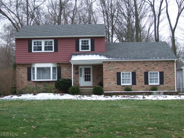 Well-kept 4-Bedroom, 2-1/2 Bath Colonial with open floor plan between eat-in kitchen to fireplaced family room.  Kitchen is updated with white cabinets, granite countertops, ceramic flooring and all appliances.  Family room has wood-burning fireplace and built-ins with slider to enclosed sun porch which leads to 2-level deck overlooking 1/2 acre leading to city owned woods.  Formal living and dining rooms with chair rail and crown molding.  Upstairs are 4 bedrooms with updated main bath with deep soaking tub and new vanity.  Master bath is also updated with tile shower and new vanity and flooring.  First floor includes half bath and entrance to attached 2-car garage.  Next to it is second 1+ car garage with heat and electric.  Basement has finished area with updated 200 amp electric box.  There is also workshop room.  Home Warranty included.  Updates include roof 2012, furnace/central air/air cleaner 2013, kitchen 2015, master bath 2017.
