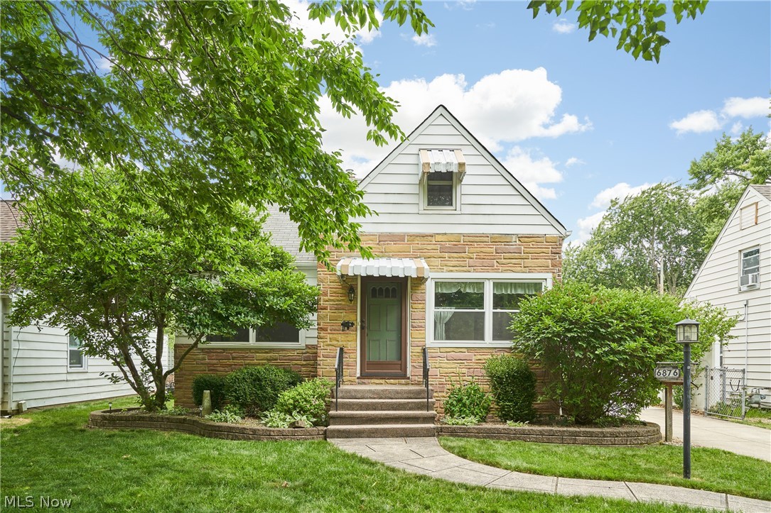 Welcome to this charming 3 bedroom 2.5 bath Cape Cod home. As you pull up, you will see evidence of the owner’s green thumb... mature trees, roses cascading the fence line and peonies welcoming you into the sunroom, which is attached to the 2.5-car garage. The bright eat-in kitchen is filled with natural light and features a built-in desk nook along with shelving, perfect for displaying cherished items. Beautiful original hardwood floors cover the living room (with gas fireplace) and the 2 first-floor bedrooms. A full bath with whirlpool tub finishes this level. Ascend the stairs to the primary suite featuring a sizable bedroom, walk-in closet, extra living space, and a half bath. There are 2 places to access the attic upstairs and both have plywood flooring for easy storage. Enjoy entertaining in the large lower-level rec room. For convenience, this level also includes a full bathroom and a bonus room for storage. All the following updates to this home took place in 2019: A/C, Furnace, Hot Water Tank and windows in
the living room, kitchen, first floor bath and the “pink” bedroom. Located in the heart of Parma Hts, you have easy access to I-71 via Bagley Rd and are close to Tri-C Western Campus, BJ’s Wholesale Club and a variety of shopping and restaurants. Call today for
your private tour.
