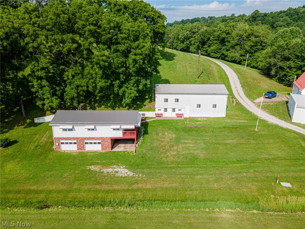 Move-in ready and packed with updates, this 2 bedroom, 1 bath home sits on 1.8 acres in the River View School District and offers convenient first-floor living. The property includes a 2-car attached garage, an attached carport bay plus a 22x54 outbuilding—ideal for storage, hobbies, or workshop space. The outbuilding has 2 individual rooms as well as a large area which houses a hoist, welder outlets, an 18' door, concrete floor and a fuel tank. Recent improvements include new central air, new seamless gutters with gutter guard, new metal roof, new water softener & system, fresh paint, and new flooring throughout. The home is vacant and ready for immediate occupancy. A great opportunity to enjoy country space with modern updates already completed. All major kitchen appliances, the large safe and any contents in the home and on the property at the time of possession will convey to the new owners at a successful closing.