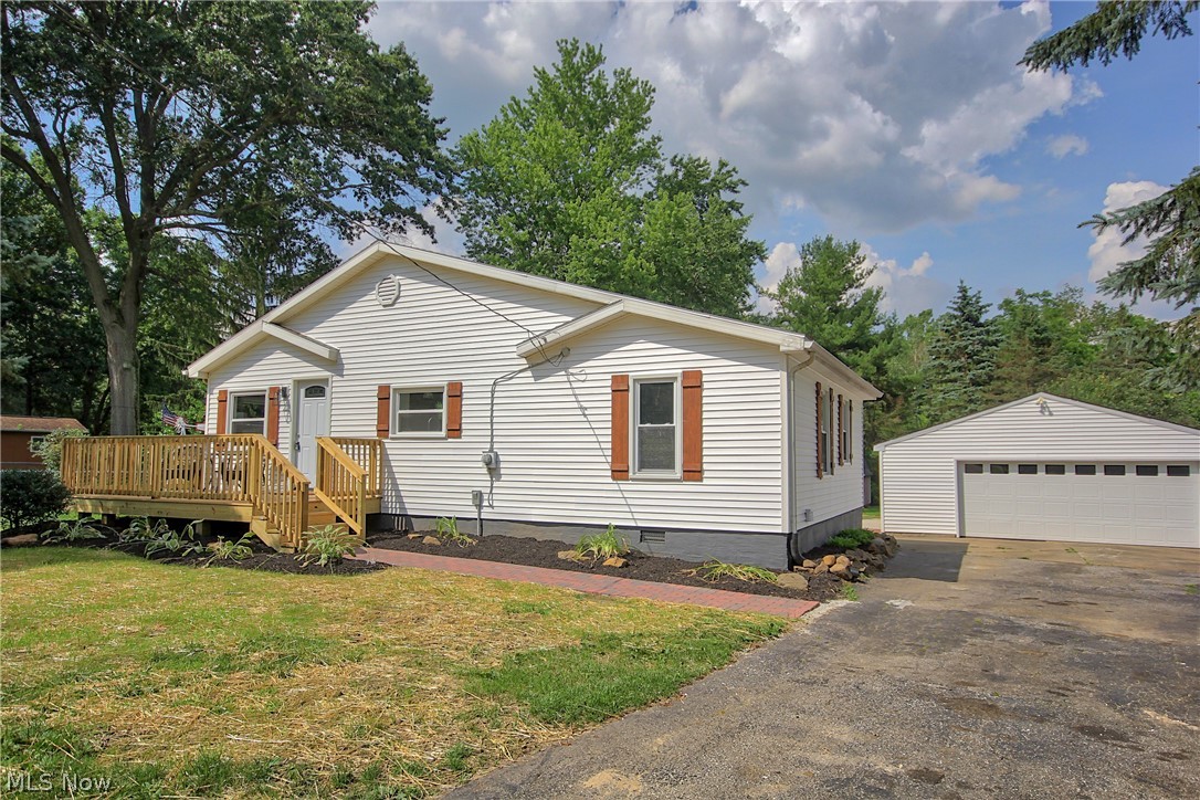 This absolutely adorable home has been COMPLETELY UPDATED!! When arriving at this charming home you will be greeted by *All new siding* New Windows *New shutters *New spacious front deck. Once entering the home you will find *New vinyl plank floors that spreads throughout that open floor plan from the living room to the kitchen. This gorgeous kitchen offers *New Cabinets *New light fixtures* New Butcher block countertops *New Stainless steel Oven & Dishwasher. Through the kitchen stepping down to the gorgeous sunroom that is lined with shiplap walls, large windows, beautiful fireplace and door exiting to a large, private backyard! The backyard features a patio, extra large two car garage, shed and charming creek. *Updated Bathroom includes *New vanity,*new light fixtures, New tub * New Flooring. Other updates include  ***New A/C** New furnace**New Carpet**New Paint**New Septic**Home is located in a great location~minutes to Target shopping center, local restaurants/shopping. Minutes fr