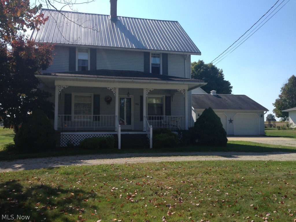 Very well maintained 4-5 bedroom, 2 bath home with beautiful wood work throughout.  Kitchen has been updated with plenty of counter space and large pantry.  4 season room has corner fireplace.  Dining area with hardwood floors and corner built ins leads to the living room.  1st floor laundry room could also be small bedroom or office area.  Full bath on 1st floor has great tub shower with ceramic surround.  Upstairs you will find 3 bedrooms and 1 full bath with double sinks.  The third floor offers bedroom plus additional loft area with closet.  Outside you will enjoy sitting on the lovely from porch or back patio.  There is an oversized two car garage plus a large barn with loft area.  This is a lot of house for the money.