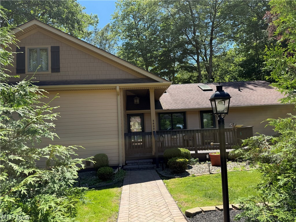 Spacious 3-4 BR, 3.5 bath, three level home offering approximately 3,500 Sq. Ft. in a quiet upscale neighborhood.  The main level features a sunken living room with a cozy gas fireplace, large eat in kitchen with Corian countertops and custom cabinetry flowing into the formal dining room, plus an enclosed screened porch perfect for relaxing or entertaining.  The private master suite includes a full bath with double sinks, walk in shower, and convenient in-suite washer/dryer.  There is also an office with a built-in desk but that room could also be used as a 4th bedroom.  A comfortable family room provides access to the wraparound deck overlooking the backyard and beautiful ravine.  Upstairs you will find 2 large bedrooms with walk in closets, a full bath and computer/TV area. The walk out lower level offers endless possibilities with glass sliding doors leading outside to a 12 x 12 enclosed screen room ready for a hot tub, a huge rec room with woodburning fireplace, full kitchen, large laundry area, full bath and surround sound system - making it perfect for a mother-in-law suite or quest quarters.  Additional features include a partial basement with newer hot water boiler and 5 zone heat, attached 2 car garage with newly poured   resin flooring, a  24 X 40 pole barn, whole house Generac generator as well as leaf guard.  Beautifully landscaped professionally.  There are 2 paved driveways plus brick out front off street parking. All appliances stay.  A tremendous amount of space, comfort and versatility for the money.  Immediate Occupancy.  Call today for your private showing.