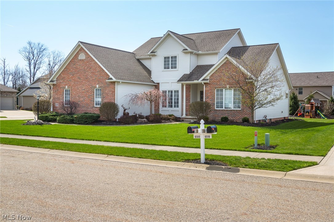 Welcome home to 6580 Donelson Cir NW in Aberdeen Ridge! Entertain your guests from this dream kitchen with SS appliances, a center island and coffee bar area which flows easily into the great room which boasts a stunning gas fireplace or move easily into the window filled dining room. The private first floor master suite has double closets, a walk-in closet and the bath has his & her sink areas with a corner garden tub! First floor laundry and a 1/2 bath round out the 1st floor. The upstairs has 3 very generous bedrooms and ample closet space along with a full bath. The custom lower level has an additional 1,084 sq ft of open concept living space. The custom bar area has just been completed with fantastic use of reclaimed wood. A beautiful 1/2 bath , office and huge storage area round out this level. This 3 car garage home all on a very well maintained corner lot can be yours today!