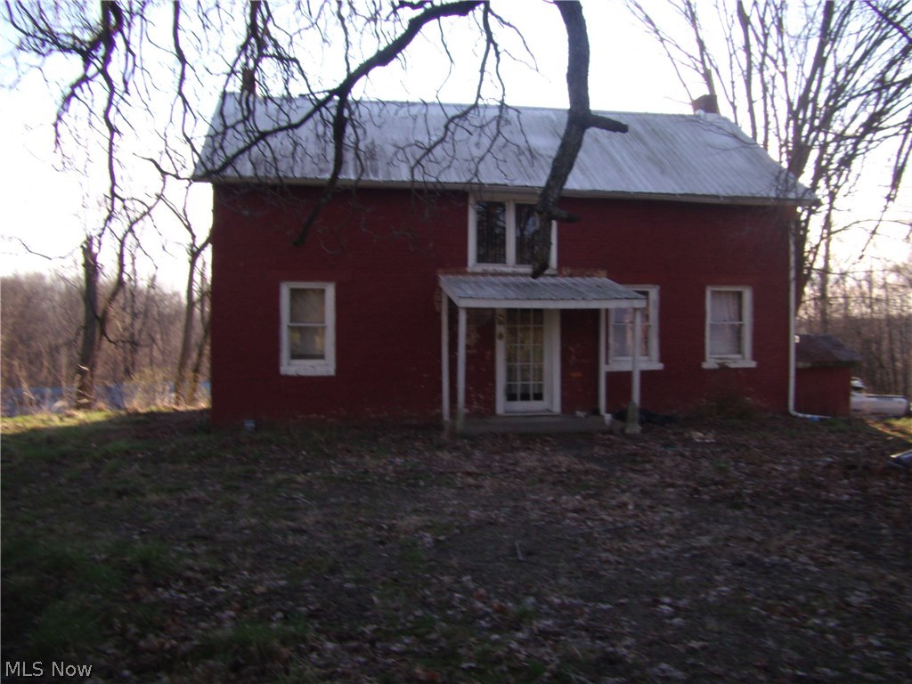 1832 Brick 2 story charmer situated on over 7 acres.  Barn with stalls, public water.