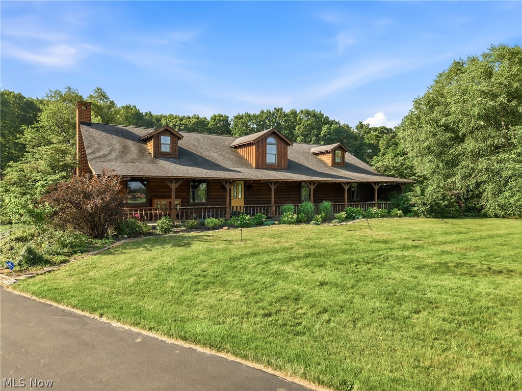 Rustic 3,000 sq. ft. log home all on one floor! Cedar and log interior walls with high ceilings. Master suite is ready for your new ideas with lots of space. 2 additional bedrooms and bath. Great room has cathedral ceilings and fireplace. Laundry area and office space just off the large, eat-in kitchen area to round up the crew for dinner! This approximately 27 acre property is nestled on a peaceful open and wooded property for the outdoor enthusiast. Stocked pond with new paddle boat and covered pavilion for those family and friend gatherings. 24x24 outbuilding for all your outdoor gear. Winding blacktop drive and 2-car garage, partial basement. Covered front porch and back wrap-around porch. Koi pond and beds of perennials. Located in sought-after South Range LSD. Positioned just minutes from shopping and dining, community center, and charm of the Salem area, or a short drive to Boardman for major retail and dining. Home built in 1987 with many improvements but ready for your own creative updates. Don't let this retreat property slip away! Qualified buyers are welcome.