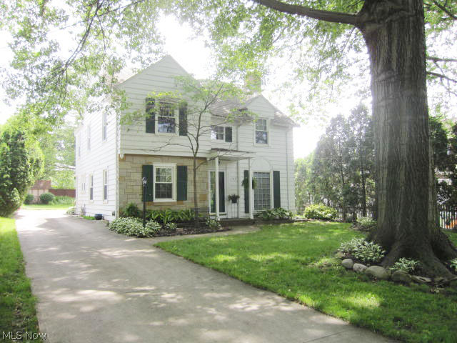 Absolutely beautiful and unique Center hall colonial off Chestnut Blvd. on one of Cuyahoga Falls widest and most attractive streets.  This 4 Bedroom 2 full bath home features hardwood floors, huge living room with wood-burning fireplace.  From living room, French doors lead to a light filled Sunroom that leads to a gorgeous and private large yard.  This home has a 2 car attached garage, huge formal dining room and a large Butlers pantry between dining room and kitchen.  Have a King size bed?  No problem here!  The Master Bedroom is large and has "his and her" closets.  A Seller's favorite is the large recreation room plus lots of extra basement storage.  Enjoy all the perks of living in the Falls including, utilities, amenities and parks.