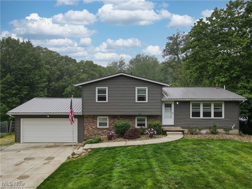 Welcome to your own private retreat in the heart of Suffield Township! This sprawling split-level everything you have been waiting for and offers space, comfort, and updates throughout. Step inside to a bright and airy great room that flows into the open, eat-in kitchen — perfect for everyday living and entertaining. With four generously sized bedrooms, there’s room for everyone, including an expansive master suite tucked away on the lower level for added privacy.

The lower level also features a spacious family room with brand-new flooring and direct access to a stunning three-tiered deck — the perfect place for summer gatherings or peaceful mornings overlooking the pool and backyard oasis. Recent updates include newer flooring throughout most of the home, vinyl siding, windows, a newer pool liner, select appliances, laundry room upgrades, a new well pump, updated wiring in the garage and deck, and an insulated garage.

Outdoors, you'll find a private, wooded backdrop complete with a sparkling pool, a large pole barn, and an additional barn — ideal for hobbies, storage, or small livestock. The multi-level deck offers unbeatable views of the backyard and a perfect setting for entertaining or simply unwinding in nature.

Enjoy peace of mind with an included home warranty. Don’t miss this rare opportunity to own a truly special home in a serene setting — schedule your private showing today!