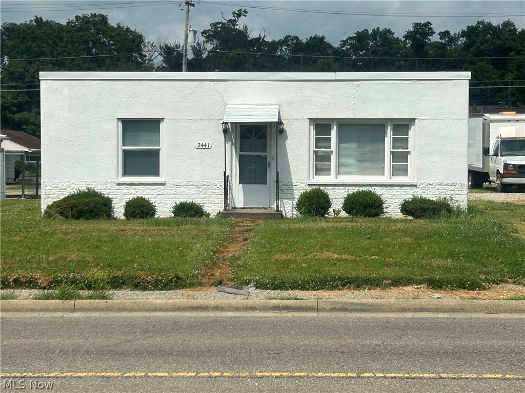 two parcels, 1)  living room, 2 bedroom house , 1 bath , on a slab with 2 car garage, 2)  the other parcel small house large living room and 1 bedroom , and1 bath on a slab