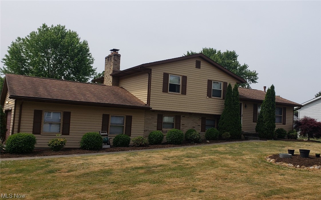 Lovely multi level on a corner lot. 3 bedrooms 2 full baths.  Kitchen features stainless steel appliances and tile floor. All three bedrooms have new carpet, master bedroom has a fireplace. Two car attached garage. Lower level is a blank canvas to provide utility as new owner sees fit.  Huge two tier back deck with fenced in area for outdoor entertaining or play. Easy access to major highways, schools, shopping, hospital. Seller is offering a home warranty. Agent owned.