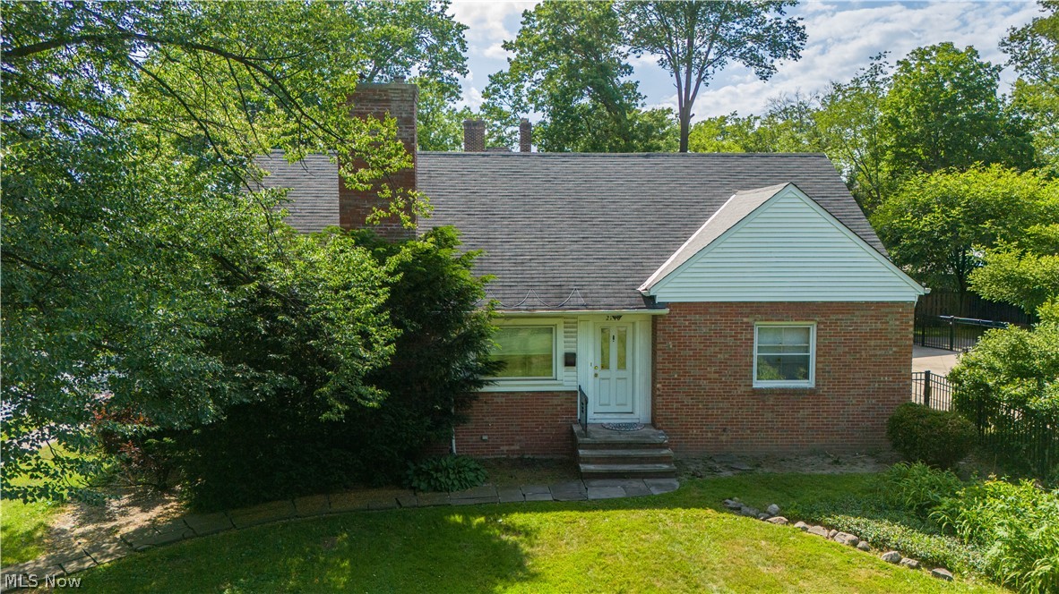 Welcome to this spacious 4-bedroom Cape Cod in the heart of Cleveland Heights! Offering nearly 1,900 square feet of living space, this charming home features hardwood floors throughout much of the main living areas, a bright living room with fireplace, formal dining room, and a sun-filled three-season room surrounded by windows. The first floor includes two bedrooms and a recently-renovated full bath with jetted tub and walk-in shower, while the second floor offers two additional bedrooms and a convenient half bath. The partially finished lower level provides additional living and recreation space, along with ample storage and laundry facilities. A detached two-car garage, newer windows, updated 50-gallon hot water tank (2024), and fenced rear yard add to the home's appeal. Conveniently located near shopping, dining, parks, and the vibrant Cedar-Fairmount and Coventry districts, this property offers excellent access to everything Cleveland Heights has to offer. Currently tenant occupied, making it an attractive investment opportunity or future owner-occupant residence.