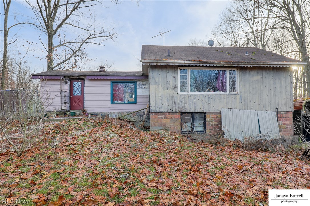 Three parcels that total 21.49 acres can be sold together or separately. Two parcels are located off Edison St. One has a single family home being sold as is. Value is in the land and outbuilding. The other parcel off Edison is ready for a home to be built where an existing single family resident used to stand facing the River/creek. Behind both parcels, 17.8 acres of unique landscapes of untouched opportunity awaits! Perfect for nature lovers, horses, ate's, hunting, you name it! So many opportunities on this secluded oasis. The views on top of the hill facing Beech Creek are stunning and can be seen from multiple scenic overlooks. The parcel with single family home has 1.84 acres and is setup for animals currently. Newer 20x30 pole building garage with 18' ceilings, electric, window, and conveniently located right off house door. Additional cemented metal carport currently being used to house docs is located on other side of home. Option to have driveway wrap around house. New septic