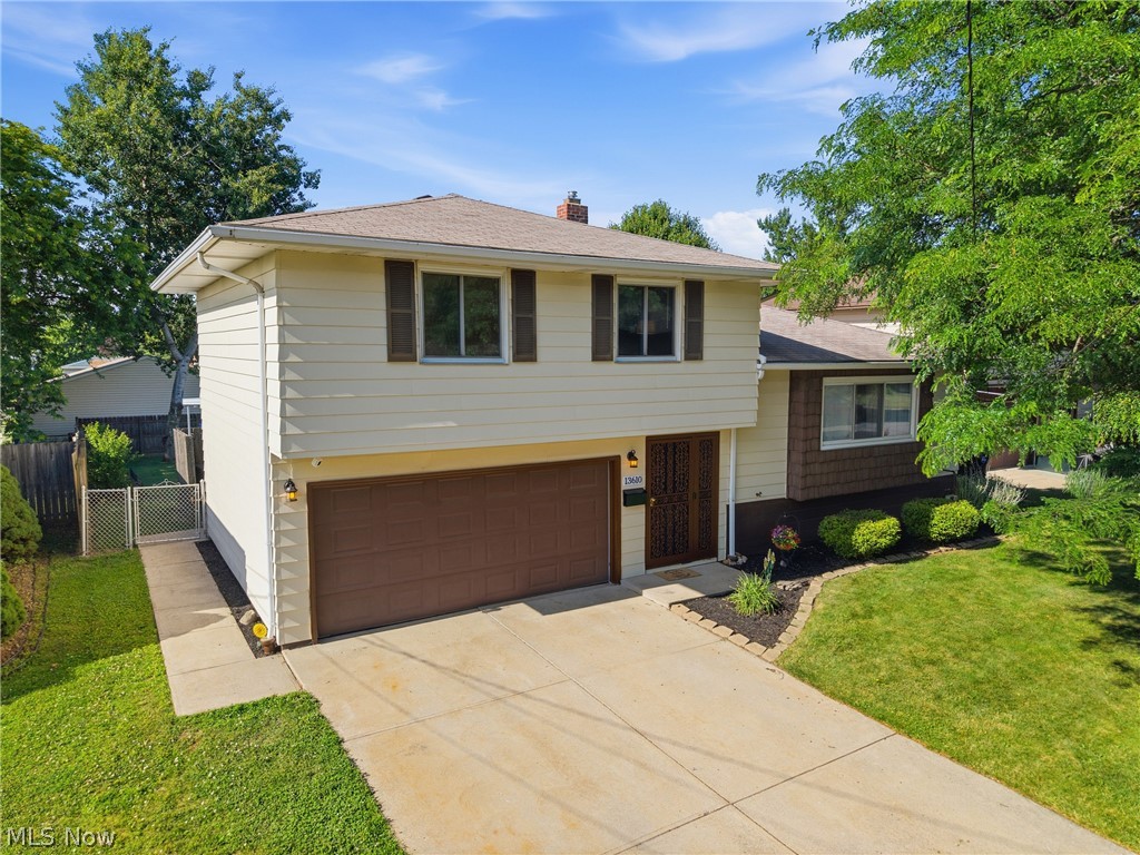 Welcome to this beautifully updated split-level home in Brook Park — where summer living is truly taken care of. Step through the brand new sliding glass door onto your private deck, and discover a backyard built for making memories. The pool and deck are only 4 years old, and the new owner gets everything they need to dive right in: a solar cover, a brand new winter cover, and a full year's worth of pool chemicals. The heated pool is ready to be connected whenever you are. The lower patio is an entertainer's dream — fire up the grill, gather friends and family, and enjoy the privacy this outdoor space provides. The kids will love the swing set, which stays with the home. Inside, the layout is just as thoughtful. The main floor features a convenient half bath, while upstairs you'll find all three bedrooms and a full bath. Major updates mean peace of mind from day one: brand new electrical panel, new hot water tank in '23, new sump pump, new landscaping, and a freshly power-washed exterior that gives the home incredible curb appeal. All appliances are included — just move in and start living. This home has it all — the upgrades, the outdoor lifestyle, and a warm community waiting for you, and for added peace of mind, the seller is including a 1-year home warranty for the new buyer. Come join the party!!!
