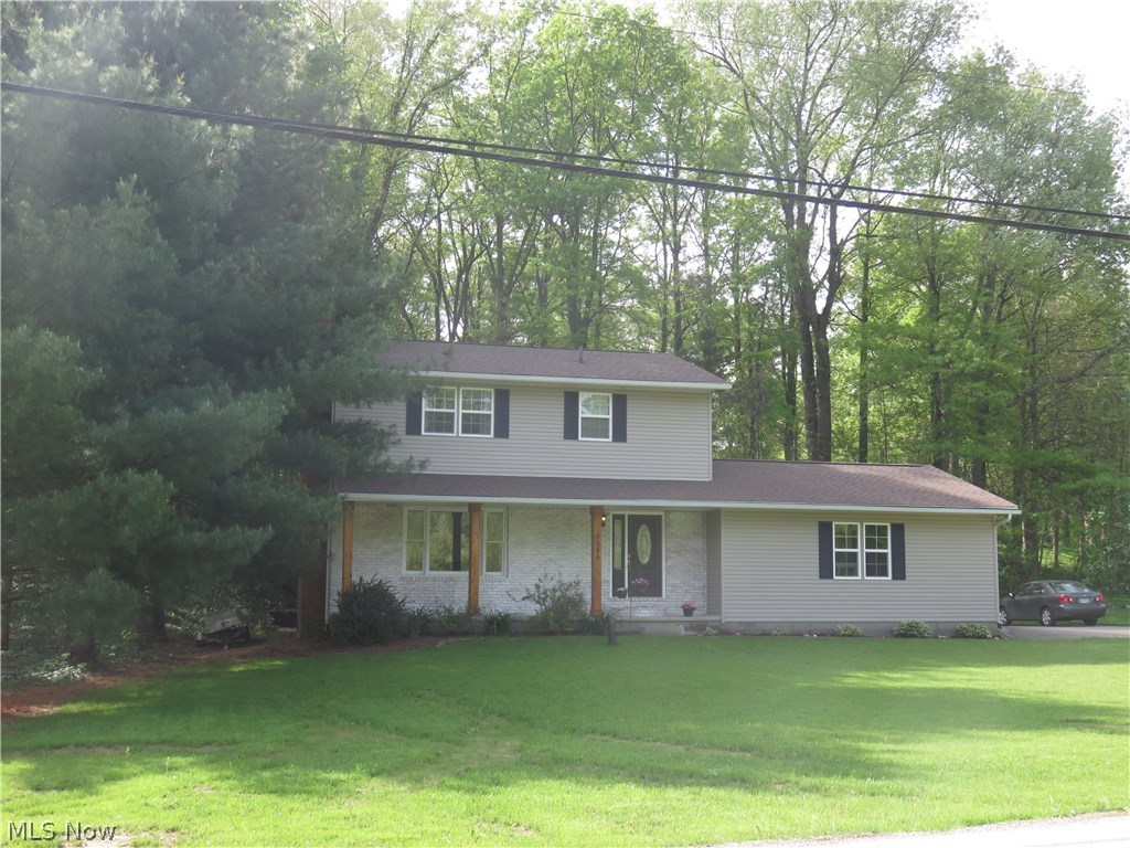 This home has been lovingly brought back to life by these sellers and you can enjoy the benefits! You will love the engineered wood flooring throughout the first floor. The large living room is accented by the wood burning fireplace, the dining room (used as office) overlooks the private backyard. The renovated kitchen has white cabs, Corian countertops. The stainless DW and fridge complete the look, so nice and bright! The Pella slider leads to the newer deck. The family room on the lower level is so spacious and so very sharp! There is a 2nd wood burning fireplace and lots of room to spread out!! You will live in this room! One sliding barn door leads to the laundry and storage areas, the other to the well room. All 3 bedrooms are up and good size. The master bdrm is large and the ensuite bath has been gutted and is very cool!! The hall bath is updated as well!! Updates include windows, glass block in bsmt, roof, siding, h2o tank, well pressure tank, water softener, lots of fresh pai