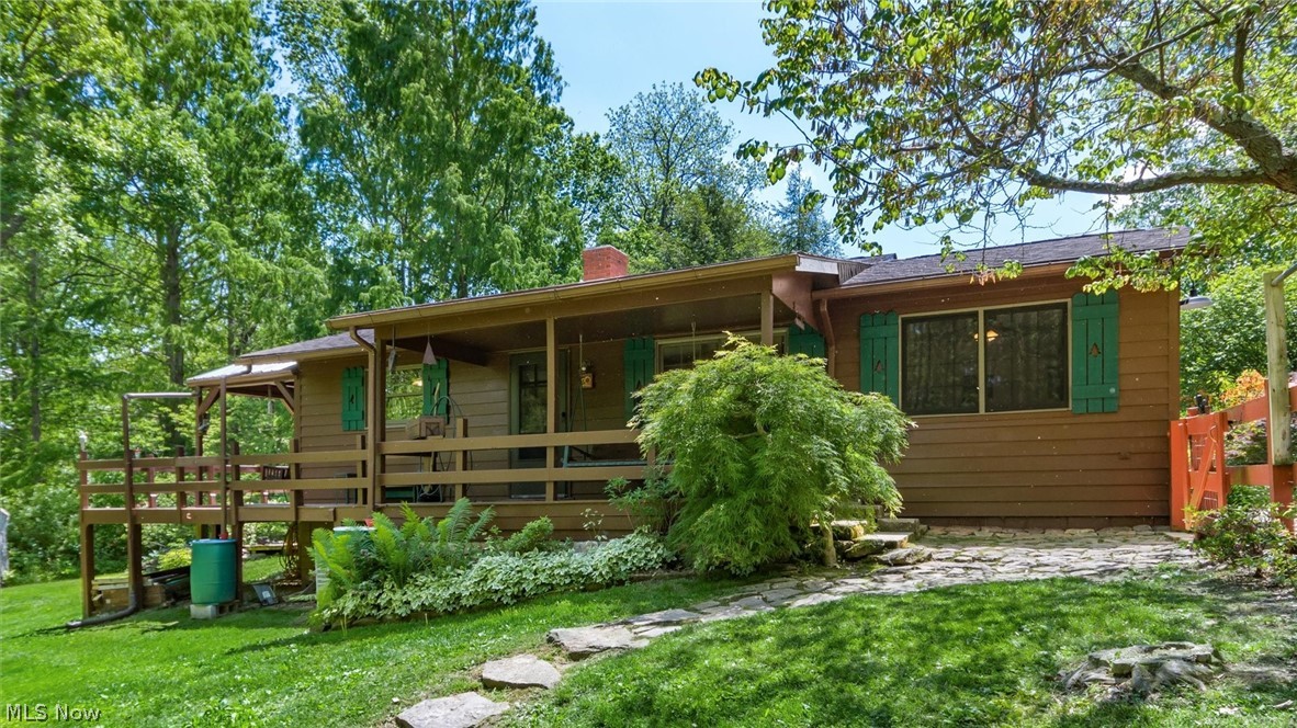 Nestled on over 12 breathtaking acres and located just minutes from Dillon State Park, this one-of-a-kind property is something you truly need to experience in person to appreciate all it has to offer. The cozy 1–2 bedroom, 1 bath home features a warm cabin-style feel with rustic charm throughout. But the true highlight of this property is the incredible outdoor setting. Enjoy a peaceful park-like atmosphere complete with a gazebo, workshop, detached garage, and stunning hand-built rock walls woven throughout the landscape. The mature timber is absolutely remarkable and has not been logged in over 40 years, offering an impressive collection of towering Dawn Redwoods, Red Oaks, White Oaks, Beech, Poplar, and Walnut trees. A rare opportunity to own a private natural retreat filled with beauty, character, and endless potential, all while being conveniently close to outdoor recreation, boating, fishing, hiking, and camping at Dillon State Park.