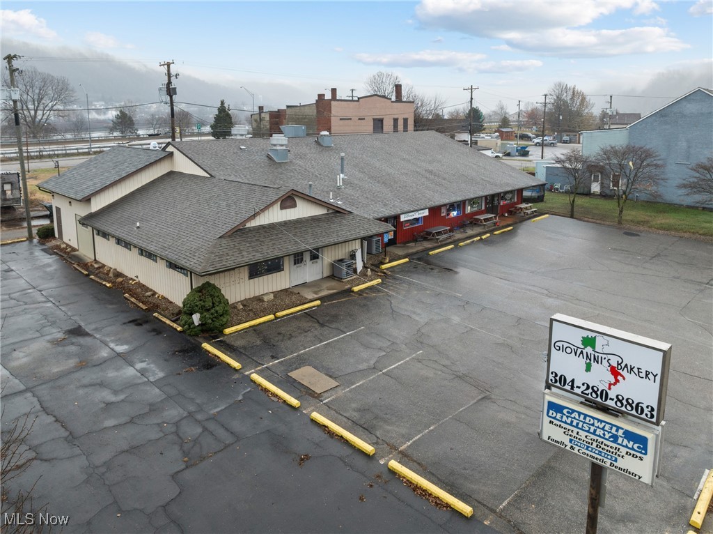 Fully leased, income-producing commercial building in a high-visibility Belmont Street location. This multi-tenant property is occupied by a dentist office, bakery/restaurant, and popular smoke shop, providing stable cash flow. All tenants pay their own utilities, and the dentist pays its portion of property taxes.

Each unit features a separate entrance and private bathroom. Recent capital improvements include a new roof and gutters (less than two years old) along with new heat pumps and furnaces in each unit. The bakery space conveys with valuable equipment, including an industrial oven, industrial mixer, and large walk-in refrigerator and freezer.

Ample parking located directly in front of the building. Strong tenant mix, prime location, and minimal landlord responsibilities make this a true turn-key investment opportunity.