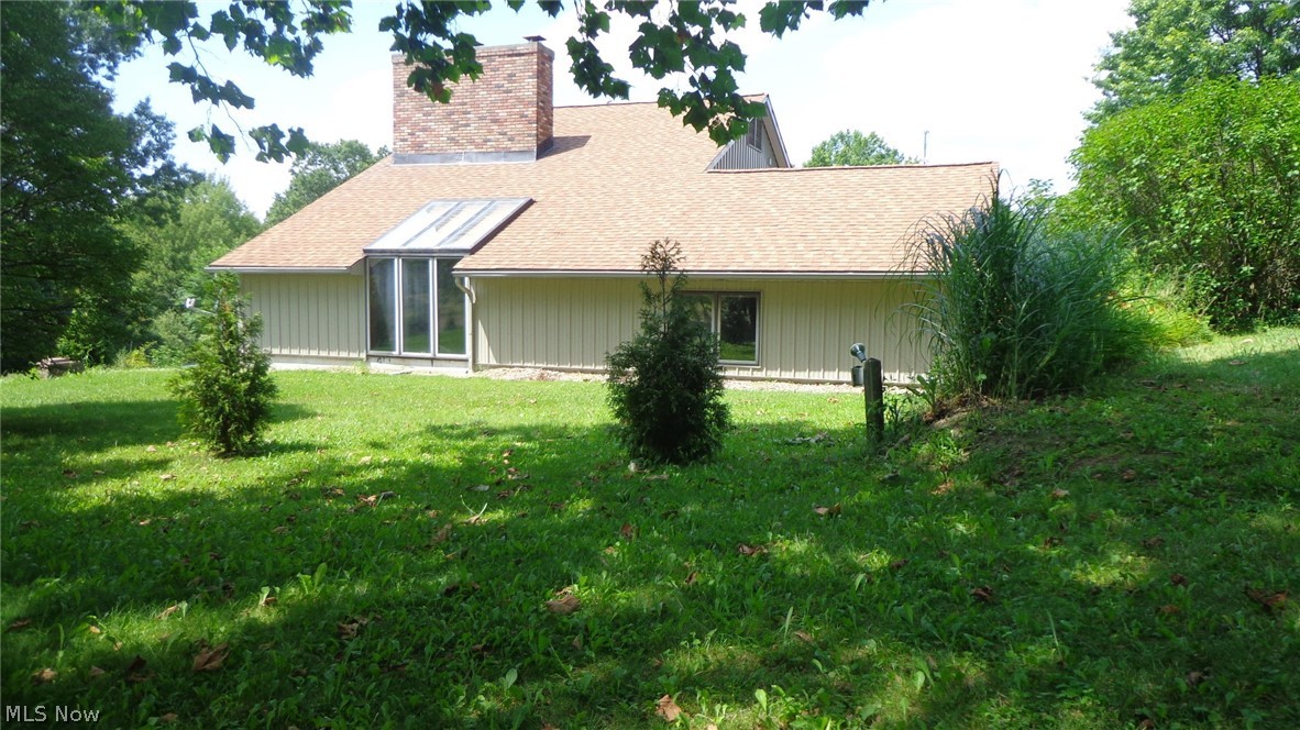 If you’ve been looking for a unique property with a multitude of  upgrades and value, then look no further than this contemporary estate with over 2.67 acres of landscaped and wooded features. The house was built according to masonry standards by a family that belonged to the Free Masons which can be displayed by it’s 15 x 20ft tall hand laid brick fireplace. The exterior has a stone retaining wall with advanced drainage system and built in lighting to greet you at the entrance. Newer vertical steel siding is guaranteed for a lifetime as well. The massive 40x40 exterior outbuilding adjacent to the house with cement floor is heated and wired for any kind of a workshop including a business, RV Parking, work shop, car collecting and beyond. If the outside isn’t enough to keep you busy then the completely renovated interior will welcome you in with it’s new flooring, countertops, paint, bathrooms, carpet in basement and handmade woodwork. Tall ceilings and a lofted master suite with a full