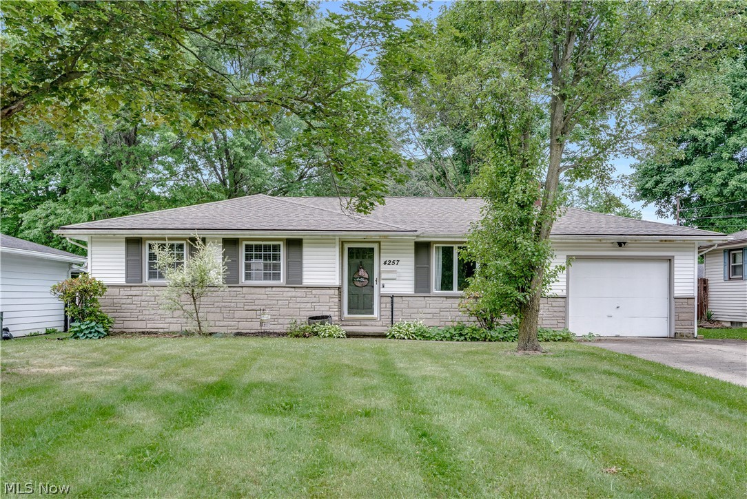 Welcome to 4257 Selkirk Ave! This move-in ready ranch has been beautifully updated and is ready for its next owner. Inside, you'll find a spacious living room with a custom wood accent wall, updated flooring throughout, and plenty of natural light. This home features three bedrooms and two full bathrooms, offering the convenience of one-floor living. The kitchen has been updated with white cabinetry, granite countertops, stainless steel appliances, and plenty of cabinet space. Major updates include a new roof and electric panel in 2021, a hot water tank in 2023, and newer appliances, giving buyers added peace of mind. Outside, you'll appreciate the attached garage, well-maintained yard, and convenient Austintown location close to shopping, dining, and everyday amenities. If you've been looking for a home that's ready to move right into, this is one you won't want to miss. Schedule your private showing today!