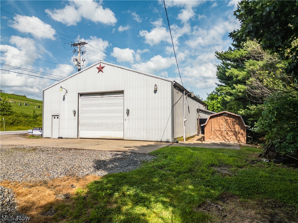 Online Only Auction Starts Ending Thursday, July 23 at 6:00 PM.  Don’t miss this excellent opportunity to purchase a commercial/residential storage property in a great location near Baltic. Situated on 0.95 acres, this property features a spacious 4,400 sq. ft. pole building with a 40' x 80' section offering 13-foot ceilings and a 12'9" overhead garage door, ideal for equipment, vehicles, or workshop use. An additional 40' x 30' section includes two 8-foot overhead garage doors, providing flexible storage and access options. A separate storage barn is also included with the property. Utilities consist of public water, natural gas heat, and a wood stove. With ample space and a highly sought-after location, this property offers endless possibilities for business, storage or investment use.