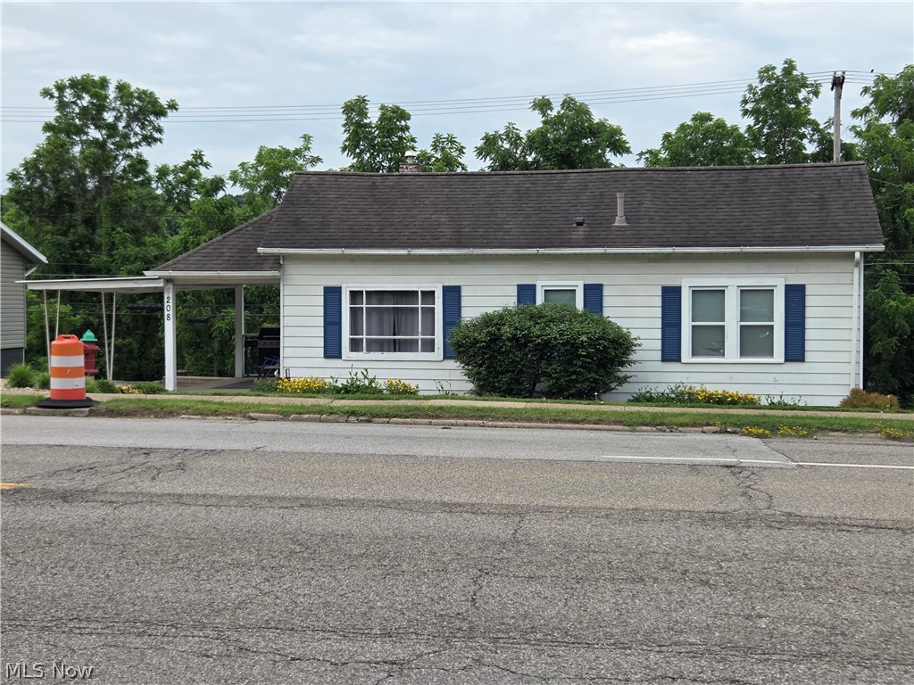 Adorable 2 bedroom home located in the heart of New Concord convenient to schools and shopping.  This home is well maintained and ready to move into.  Enjoy the large back yard including a 12x12 outbuilding with shelves for lawn equipment and storage.  Also features a walk out basement and all window air conditioners will stay.
