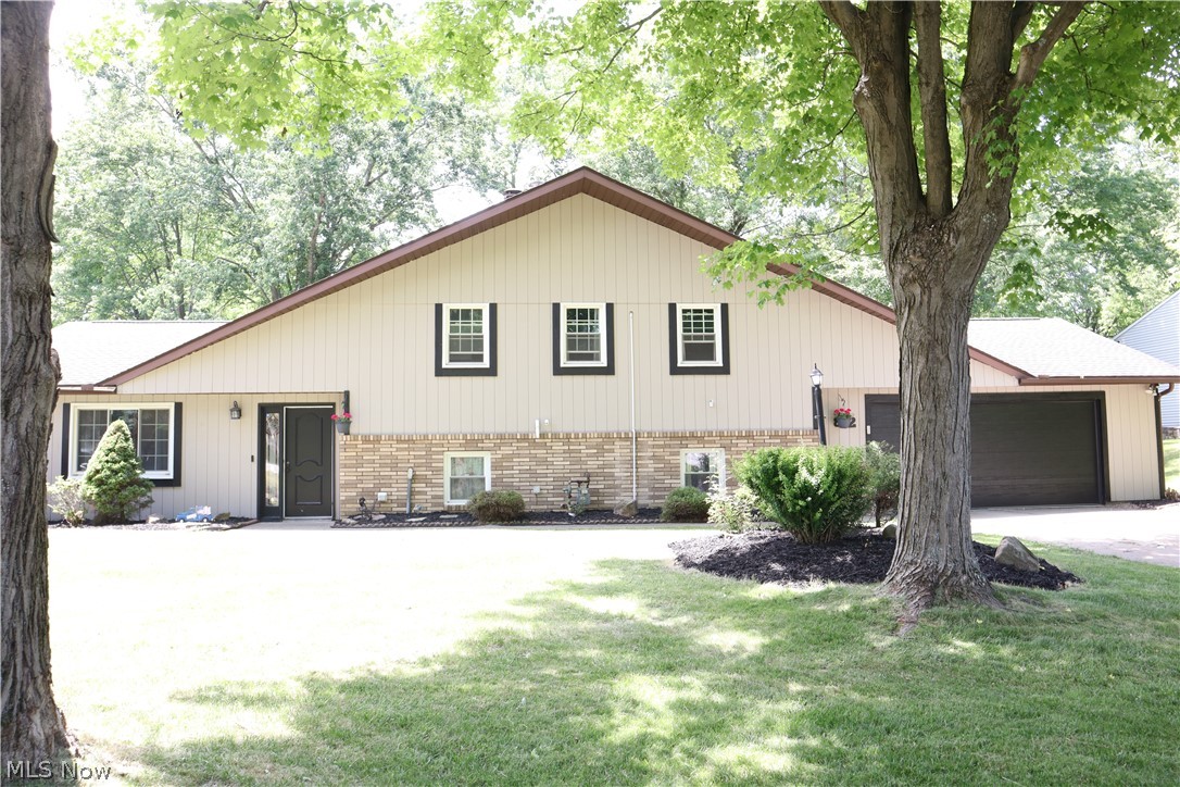 Open Floor Plan, spacious rooms, updates all around. 2600 sq feet of finished living space, on a functional fluid floor-plan. This 3-bedroom split level home has a large family room with a guest bathroom off the attached garage, a spacious kitchen with back yard entrance and living room at the front door entrance. The three bedrooms are situated on the second level with a full bath in the hall, the primary bedroom has an en-suite full bath. The kitchen received a full custom remodel, replacing the sliding glass doors and removing the upper half of the wall to the living room in 2021. The remodel includes custom cabinetry, quartz counters, kitchen island and range hood. The upper-level hall bath also received a full remodel in 2021, when all fixtures were removed and replaced. The electrical panel, boiler, and zoned cooling/ heat system were replaced or installed in 2021 as well. The garage door was replaced in 2023. The big-ticket items are done here, make this your next home.