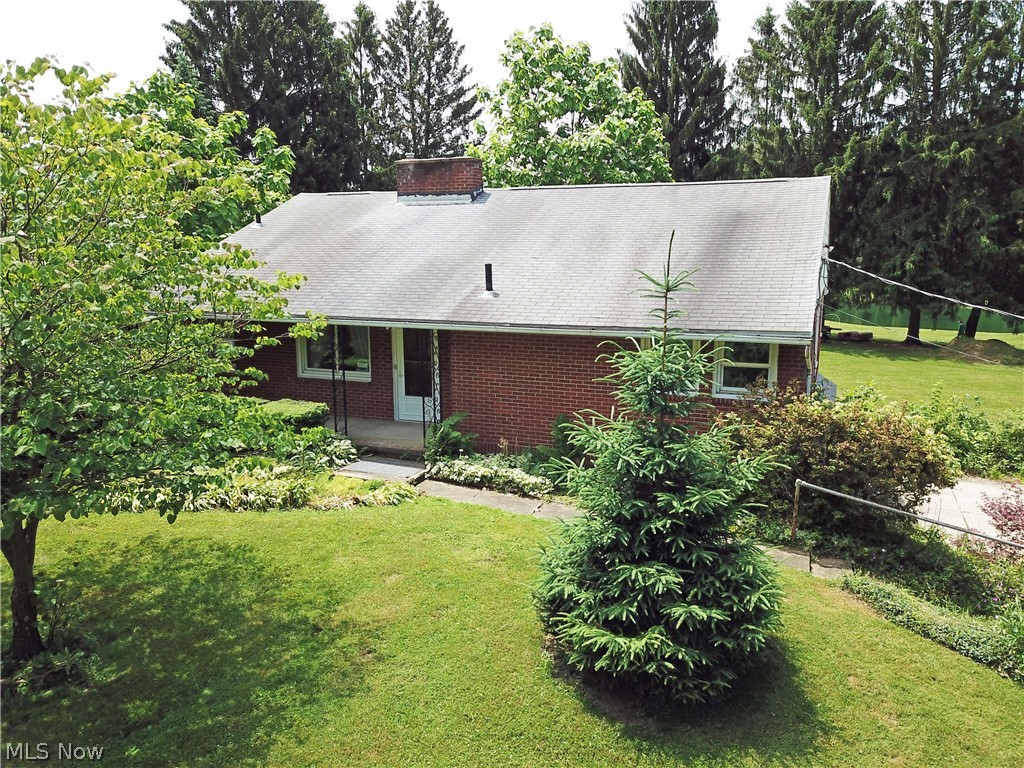 Welcome to 13039 Doylestown Rd in Rittman. This 3 bedroom, 2 bath brick ranch sits on a private, serene property that stretches over 7.2 acres. Spacious living room with fireplace and large window over looking the beautiful backyard. Kitchen has plenty of cabinets, perfect for storage and has access to side yard.  Partially finished basement with large bonus room, wet bar, wood burning stove, and full bath.  With three ponds, two of which are stocked, multiple fruit trees and berry bushes, this property is every nature lovers dream! Call today to schedule your private tour!