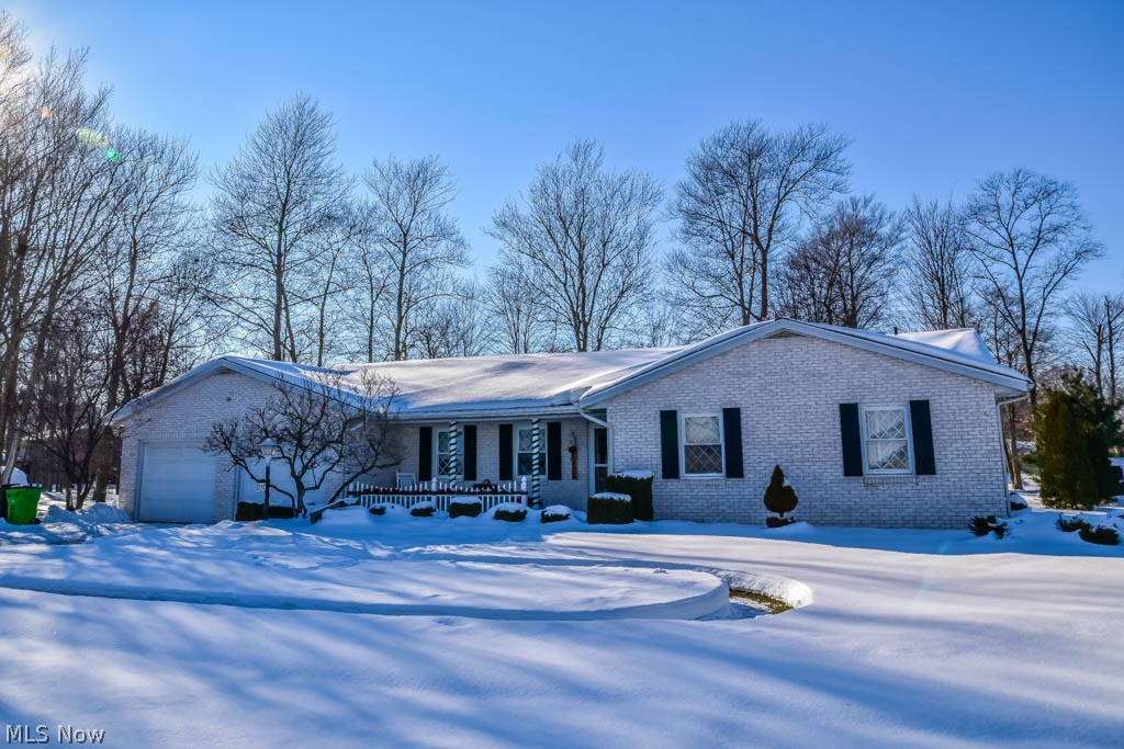 All brick ranch in Marlington schools! Situated in an established neighborhood with a nice sized partially wooded lot, this is the home you've been looking for. Two living areas provide space in the front living room for quiet activities and a family gathering spot in the den with a fireplace flanked by built-ins. The open concept keeps you connected to the eat-in kitchen with room for a dining table plus a breakfast bar. A 4 season sunroom with vaulted ceiling offers great views of the backyard. There are 3 bedrooms including a master with 2 double closets and a private bath with tiled shower. The 1st floor laundry makes this true 1 floor living! Lots of storage space in the basement plus there's a shed and attached 2 car garage. Don't miss out on this well kept beauty, schedule your showing today!