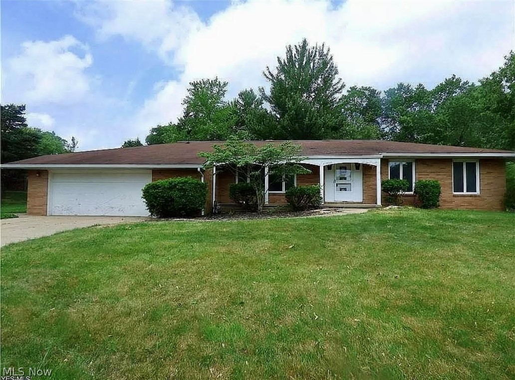 This sprawling brick ranch has 1698 square feet of living space. It hosts three bedrooms, two and a half baths and a full basement,  The basement is partially finished, and has an extra high ceiling....there is a full kitchen area in the basement as well as a newly remodeled full bathroom. Within the last year  new carpet and a remodel of the main floor kitchen, main  full,  and half bathrooms have been done..... The three bedrooms have hardwood floors. The windows  are  Anderson brand. There is an attached garage with ample parking for 2 cars and storage. Basement has garage access. The enclosed patio is a great place for seasonal entertaining. Nestled on a quiet street this home sits on nearly a half an acre of land. Broadview Heights is a great place to call home. Centrally located it is about 20 miles from Hopkins International Airport and less than 20 miles from downtown Cleveland. Broadview Heights has great top-rated schools and is ranked 7th safest city in the nation. With near