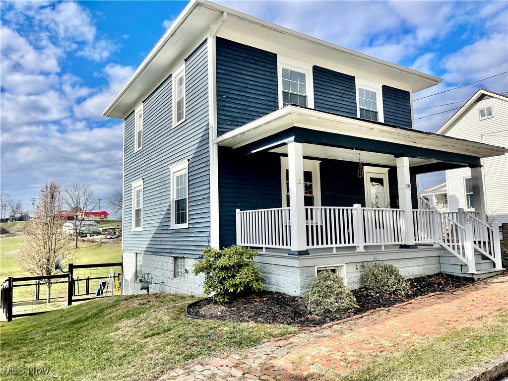 Charming 3 Bedrooms, 2 Full bath home with original wood trim and replacement windows.   9 foot ceilings on the main floor and tons of character. The rear yard is fenced with a large shed type barn with attached stable for your small animal.  The large front porch invites you to relax after a long day. Windows, furnace, AC, hot water tank and porch all 2015. Stainless kitchen appliances. Full bath/ laundry on the main floor plus full bath upstairs. All of this just and easy walking distance to downtown and on a dead end street.