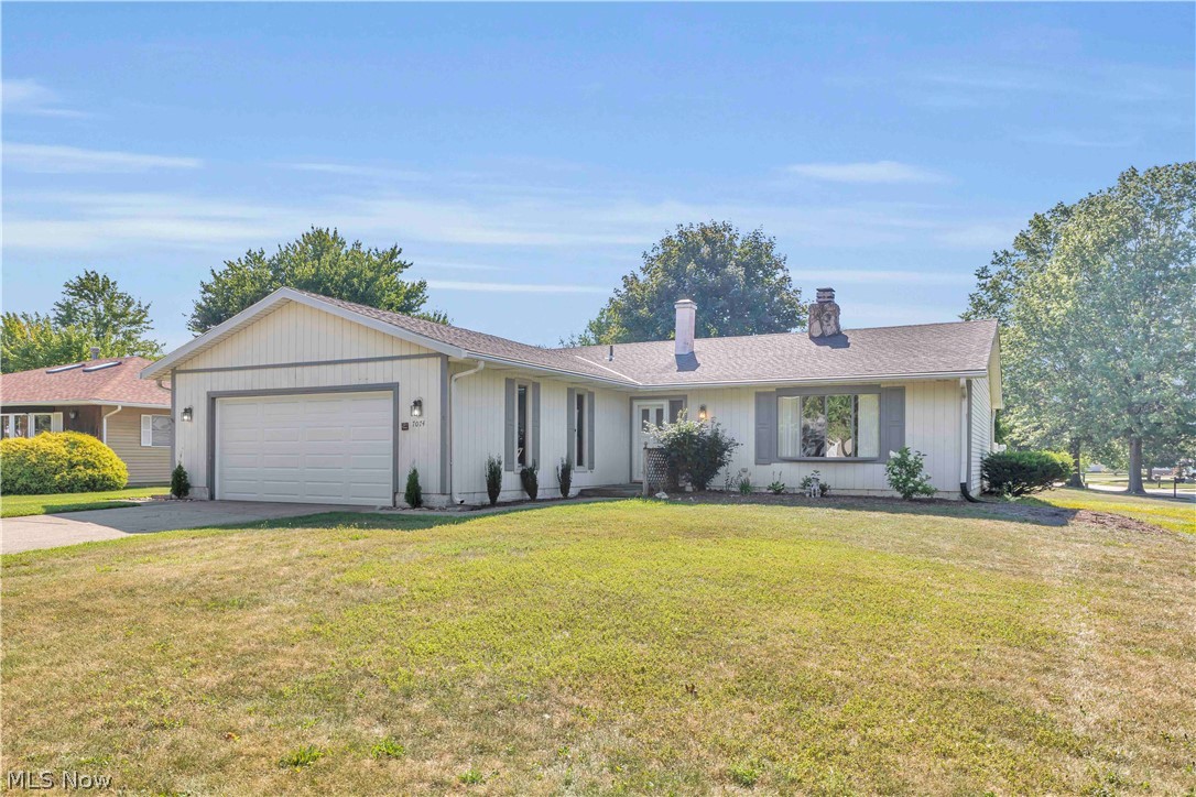 Three bedroom, two full bathroom ranch on a quarter acre corner lot in the heart of Mentor! Featuring a two car attached garage with a newer door, opener, and freshly painted interior completed in 2023. The entrance foyer opens to a light filled formal living and dining area, enhanced by a bay window with newly installed insulated glass and views of the serene neighborhood. Directly to the left of the foyer is the updated laundry room offering fresh paint, laminate flooring(2024), washer/dryer(2024), utility tub, and storage. Beyond the twin-double door coat closets, the main living area flows into an open kitchen and family room design. All kitchen appliances remain, with new flooring installed in 2025. The great room offers warmth and presence, featuring a striking floor-to-ceiling white stone gas fireplace that serves as a stunning focal point. The soaring vaulted ceilings enhance the sense of space and elegance, while the textured finishes and accent lighting create a cozy yet refined atmosphere for intimate gatherings or relaxed evenings at home. The hallway offers a convenient linen closet opposite the full bath, leading to three spacious bedrooms, including a primary suite with a large closet and private en-suite walk in shower. Open to the kitchen, the great room has a sliding glass door to the sunroom, surrounded by a fully fenced private backyard and patio. Enjoy peace of mind with many windows replaced within the last five years, a 2021 hot water tank, and HVAC serviced annually (2021-2026). The fireplace and chimney were recently swept, inspected, repaired, and tuckpointed, and the seller is offering a home warranty. Located on a low traffic loop in Mentor, the desirable Wayside Lakes features scenic fishing ponds and spacious common areas. Residents enjoy exceptional value and effortless commutes via SR 2 and I 90, with top rated Mentor schools, Lake Erie beaches, parks, major healthcare facilities, and premier shopping and dining all just minutes away.