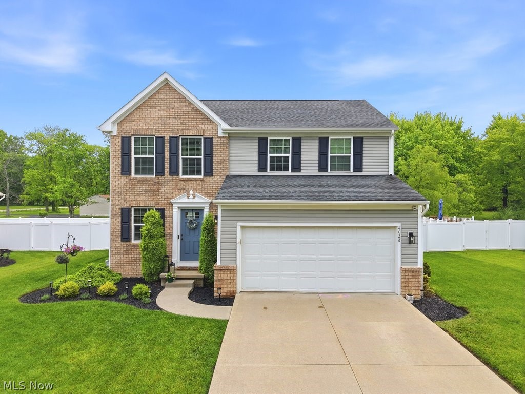 This beautifully maintained colonial is located in the desirable Whispering Woods community within the Field Local School District. 4028 Willow Way features an open-concept main floor with neutral décor and charming details throughout. A light-filled morning room/dining area opens to a private, fully fenced backyard.  The oversized stamped concrete patio is ideal for relaxing or entertaining. Upstairs you will find three bedrooms including a large primary bedroom, with en-suite bath and walk-in closet.  A versatile second-floor bonus room provides the ideal space for a nursery, home office, or craft/art room.  The spacious lower level is ready for your finishing touches to create additional living spaces. The home has been wired with Cat 6 cables for internet and also has a wired, zoned speaker system. Conveniently located in Brimfield Township with easy access to highways, shopping, Kent State University and NEOMed University, Whispering Woods is the ideal neighborhood, complete with paved sidewalks and charming streetlamps.