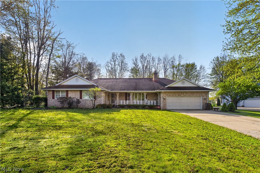 Welcome home to this beautiful and spacious 3 bedroom 2.5 bath ranch home in Champion! There is a 2 car attached garage with an additional 3 car garage behind it with front and rear garage doors. The rear garage measures 26 by 27. Entering the home there is a living room with a fireplace that opens up to the eat in kitchen with an island and ample cabinet space. Formal dining room leads to the Florida room with lots of natural light and can be enjoyed year round. You can walk out on the back patio from the Florida room for outdoor entertaining. This home features a master bedroom with master bathroom, walk in closet and his and hers closets. There are also 2 additional bedrooms and another full bathroom. Heading in from the garage entrance there is a utility room with a laundry area and half bathroom. This utility room also has a door leading to the outside patio in the back yard. There is an expansive full basement that can be finished in any way that fits your needs. New furnace 2024. New refrigerator 2020. This home is a one owner home that has been very well maintained! If you are looking for a home in Champion this is one you don't want to miss! Call for your private showing today!