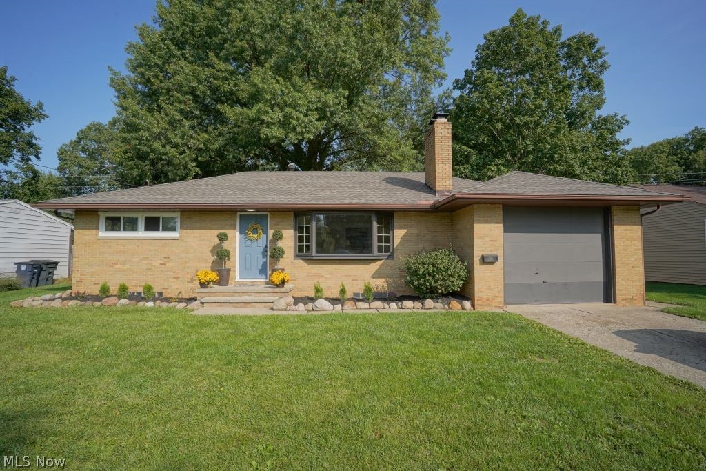 Spectacular brick Mid-Century Ranch in prime West Akron location. This amazing home has been been brought into the 21st Century with sophisticated and current updates.  Great curb appeal boasts landscaping features that include river stone rocks and crisp perennial shrubbery. Gorgeous brick woodburning fireplace in living room. The entire interior has been repainted in 2020 in fashion neutral colors!  Kitchen has been completely remodeled, including shaker styled white cabinetry and beautiful vinyl plank laminate flooring. Most of the 1st floor features natural hardwood flooring. 3rd bedroom can be den /family room and has views of covered patio and landscape. Windows replaced in 2020 along with a brand new complete "tear off" roof in 2020. Throughout the home you will notice cutting edge lighting that includes LED canned lighting. Seller replaced electrical Service box recently and there's plenty of space to add on. Seller replace much of the plumbing. The ceiling on patio overhang is